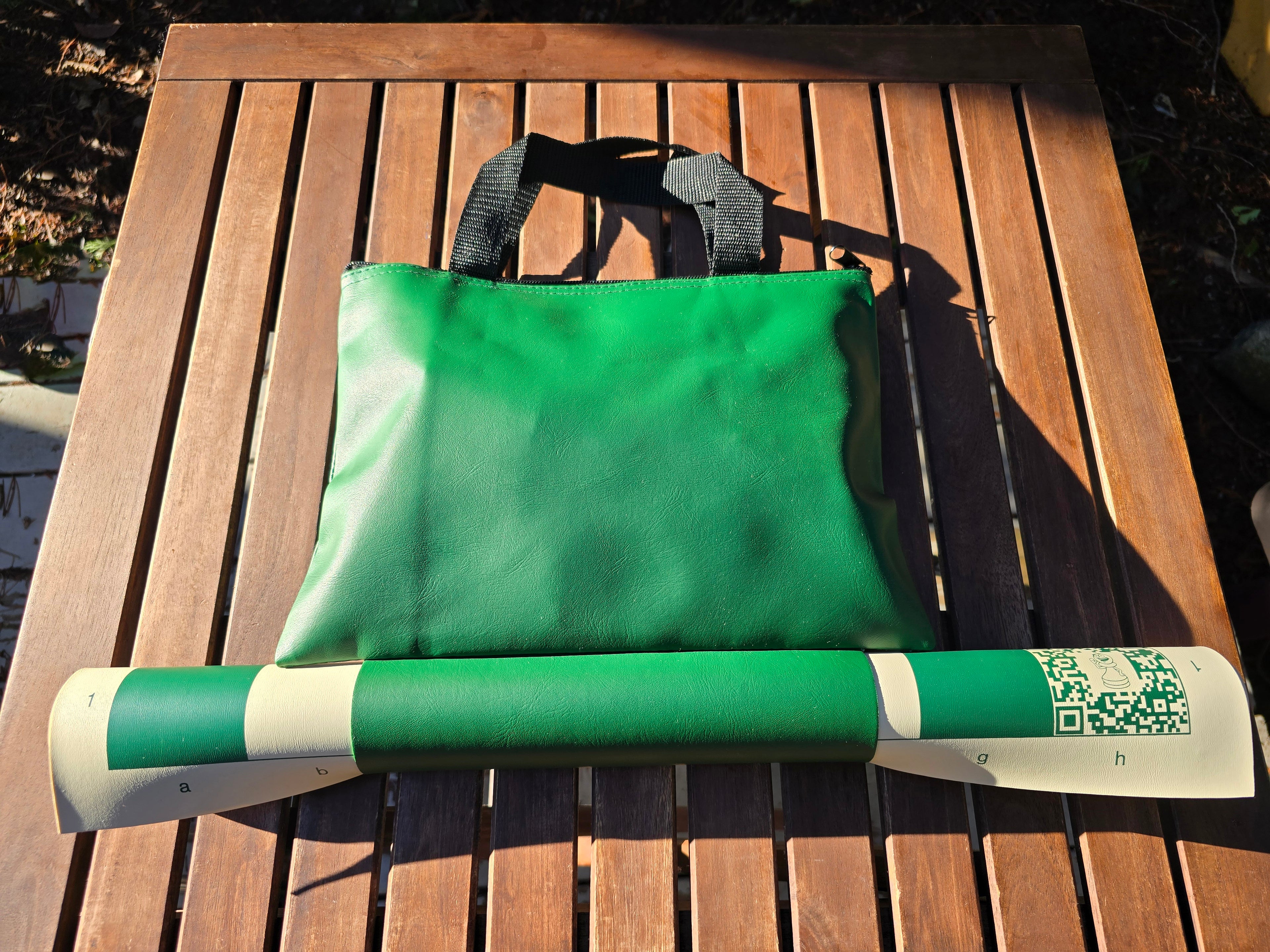 ChessKid Tote Chess Set with Vinyl Chess Board Packed on Patio Table