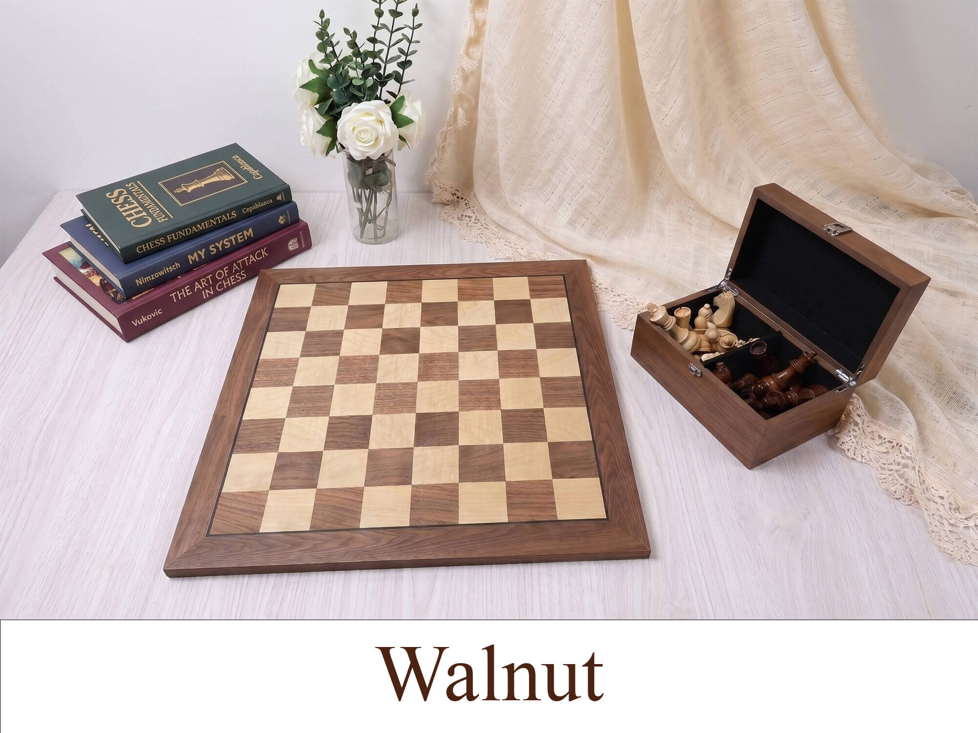 Monarch Series walnut wooden chess board and storage box displayed on a beige table, showcasing the rich natural wood grain and 57mm squares.