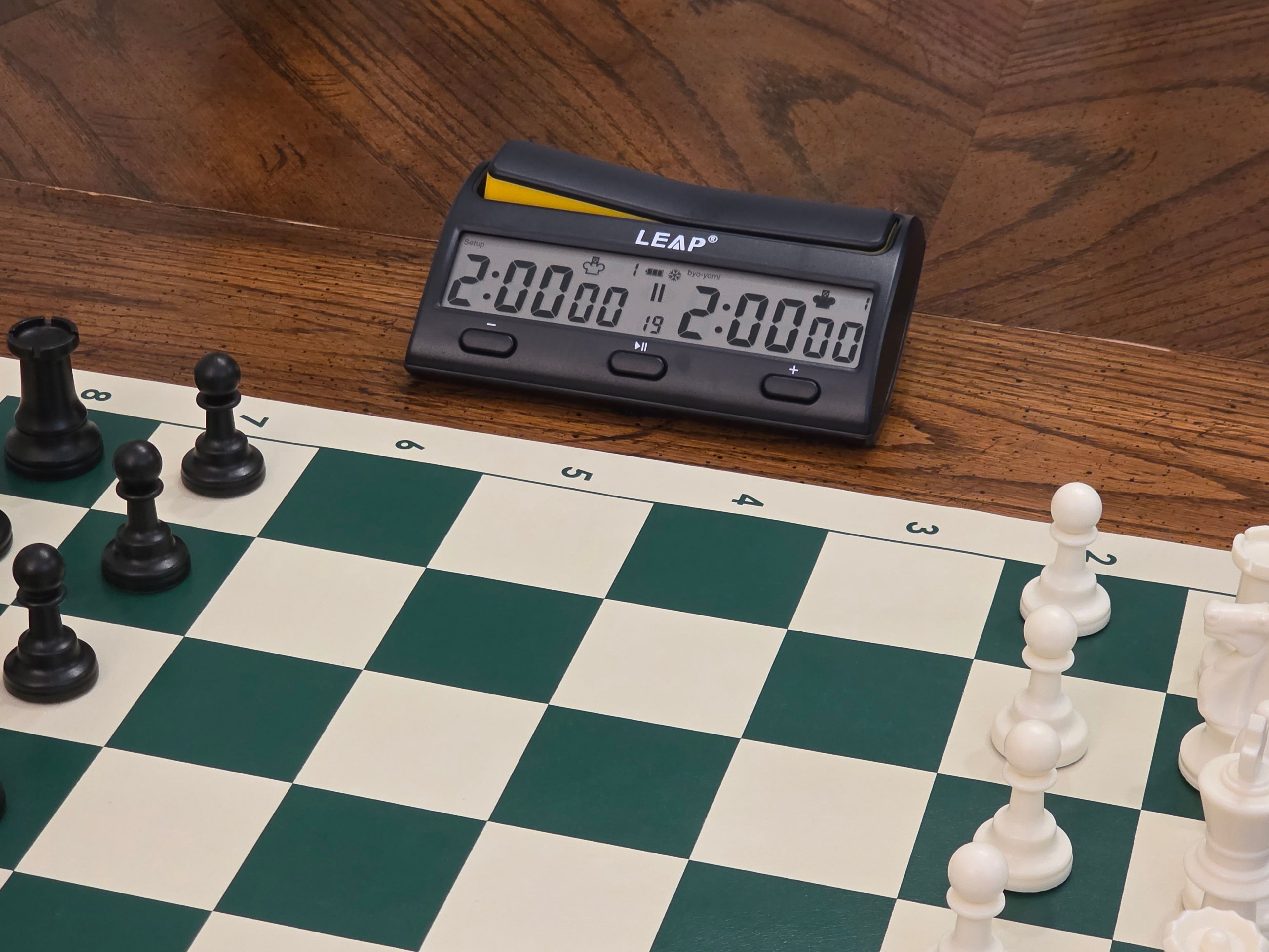 Leap KK9909 Chess Clock Beside Chess Board