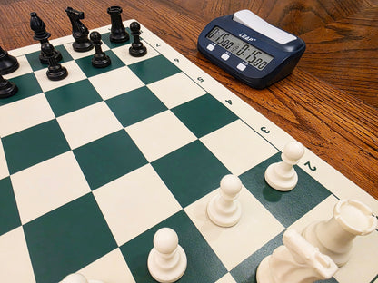 Leap PQ9923 Chess Clock next to Board on Wooden Table