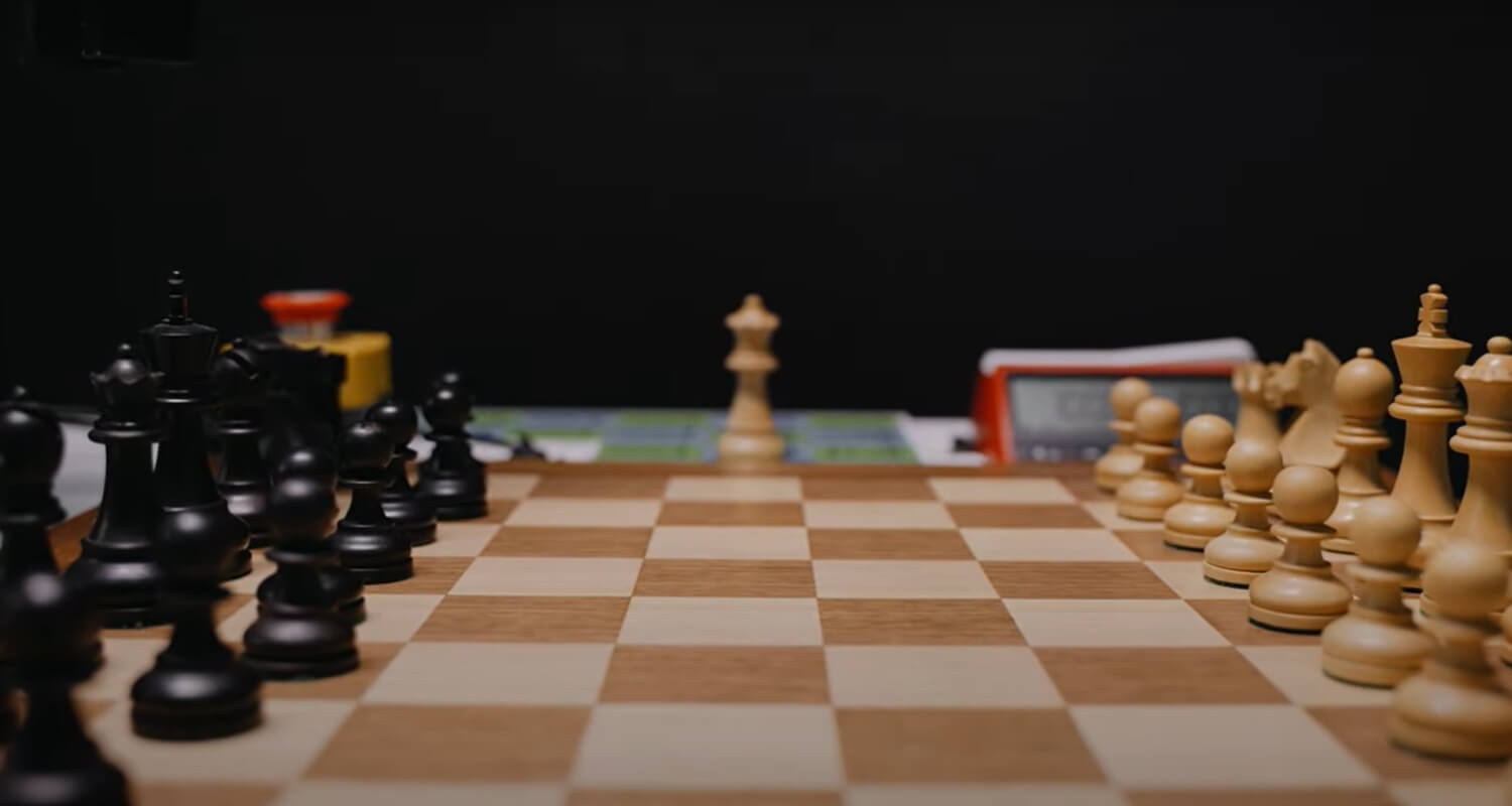 Side Shot of a Wooden DGT Electronic Chess Board with Carved Black and White Pieces