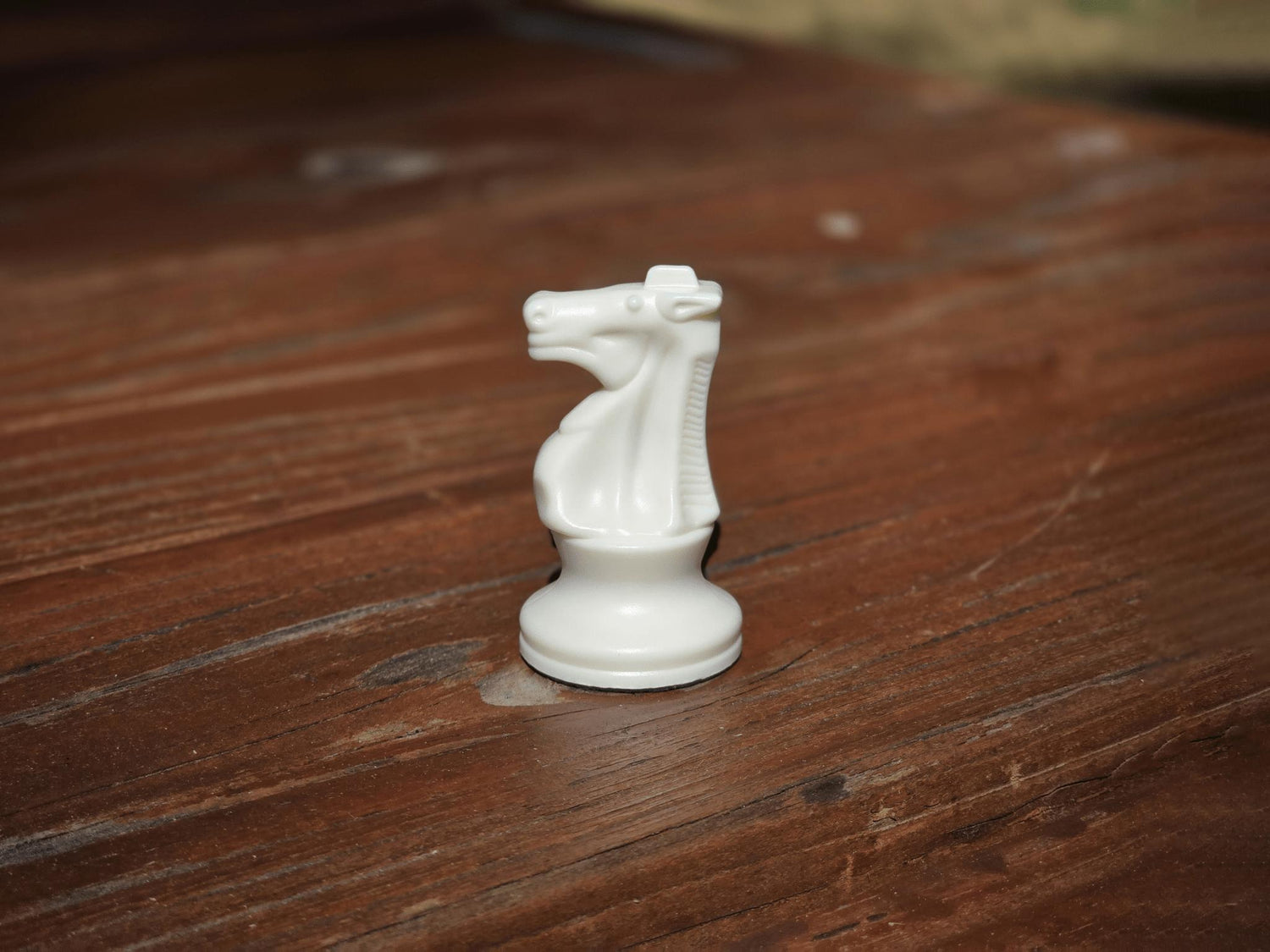 White Knight on Wooden Park Bench