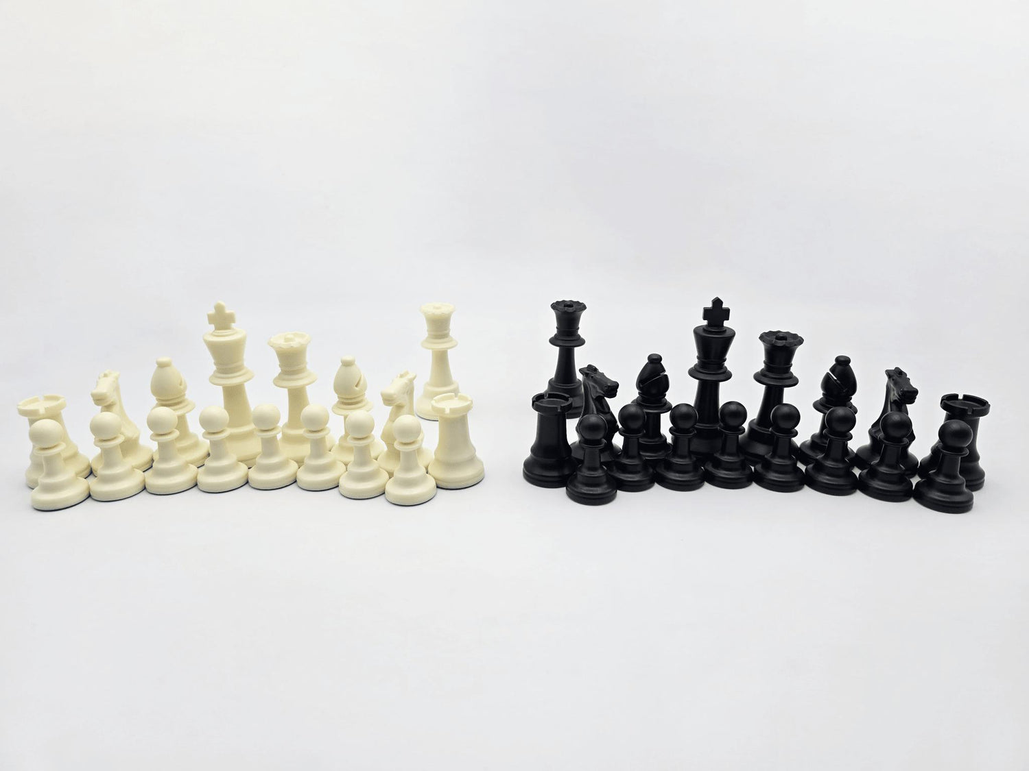 White and Black Chess Pieces in Semicircular Arcs in Lightbox
