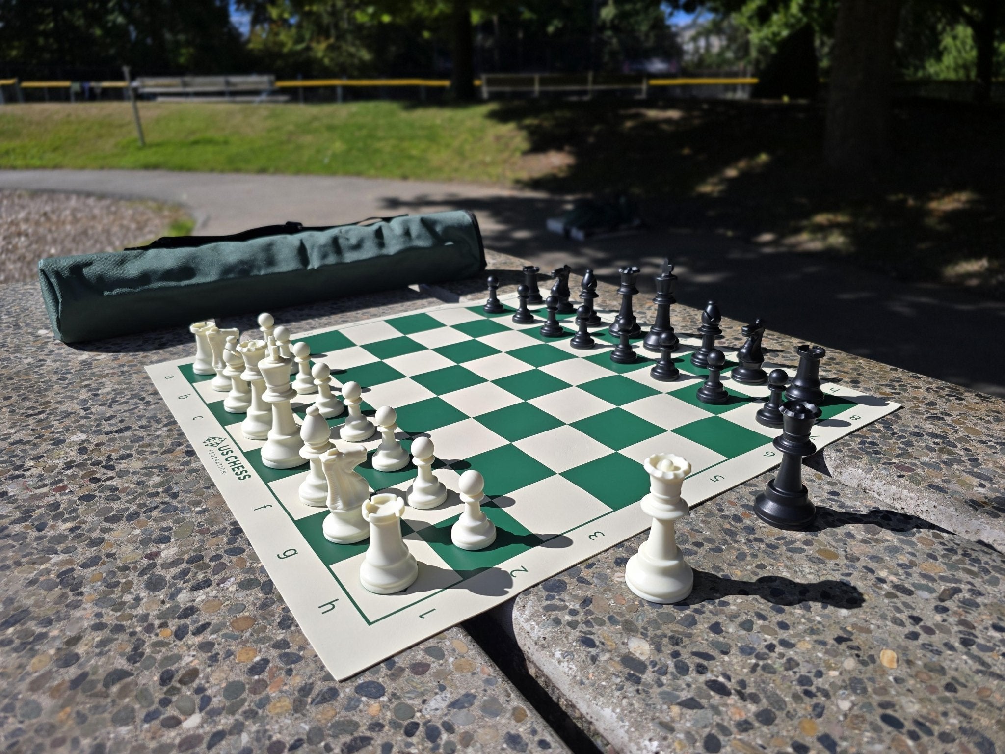 US Chess Federation Tournament Chess Set with Vinyl Chess Board and Quiver Carrying Case on Stone Table