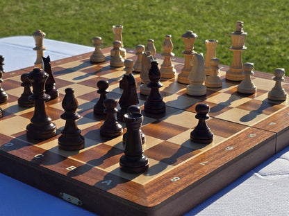 Wide angle view of the complete Aristocrat folding wooden chess set with all pieces arranged for play.