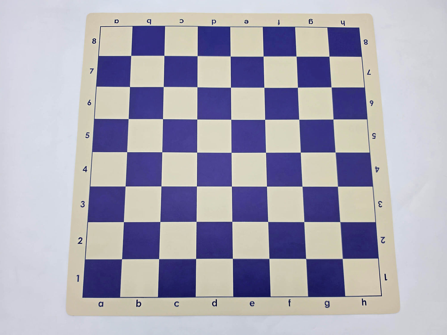 Roll-up blue and cream vinyl chess board with algebraic notation.