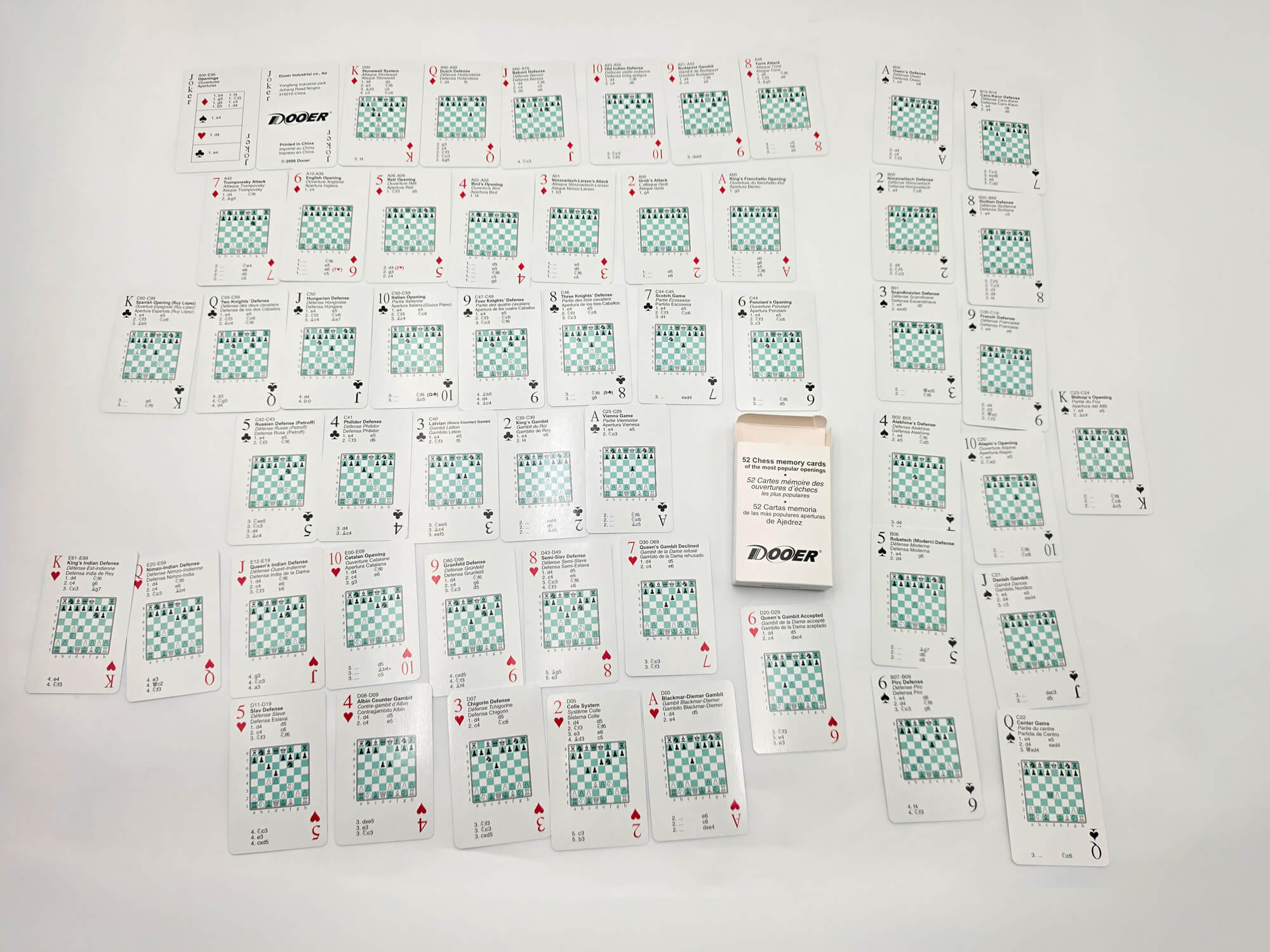 Complete 52 chess opening flashcards set laid out on a white surface with tuck box