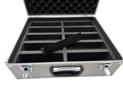 Open DGT aluminum carrying case showing foam padded interior compartments designed for 10 chess clocks and one foam wedge removed.