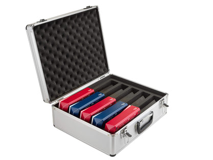 Open DGT aluminum storage case half filled with five red and blue DGT digital chess clocks in padded slots.