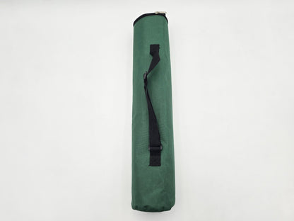 Vertical view of a forest green quiver-style chess bag with a black shoulder strap on a white background.