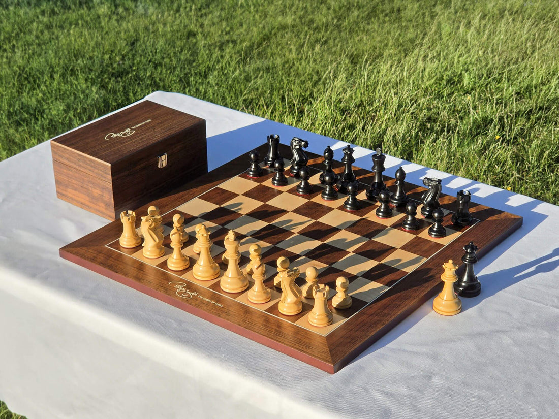 Full Judit Polgar wooden chess set set up on the board with the wooden storage box in the background.