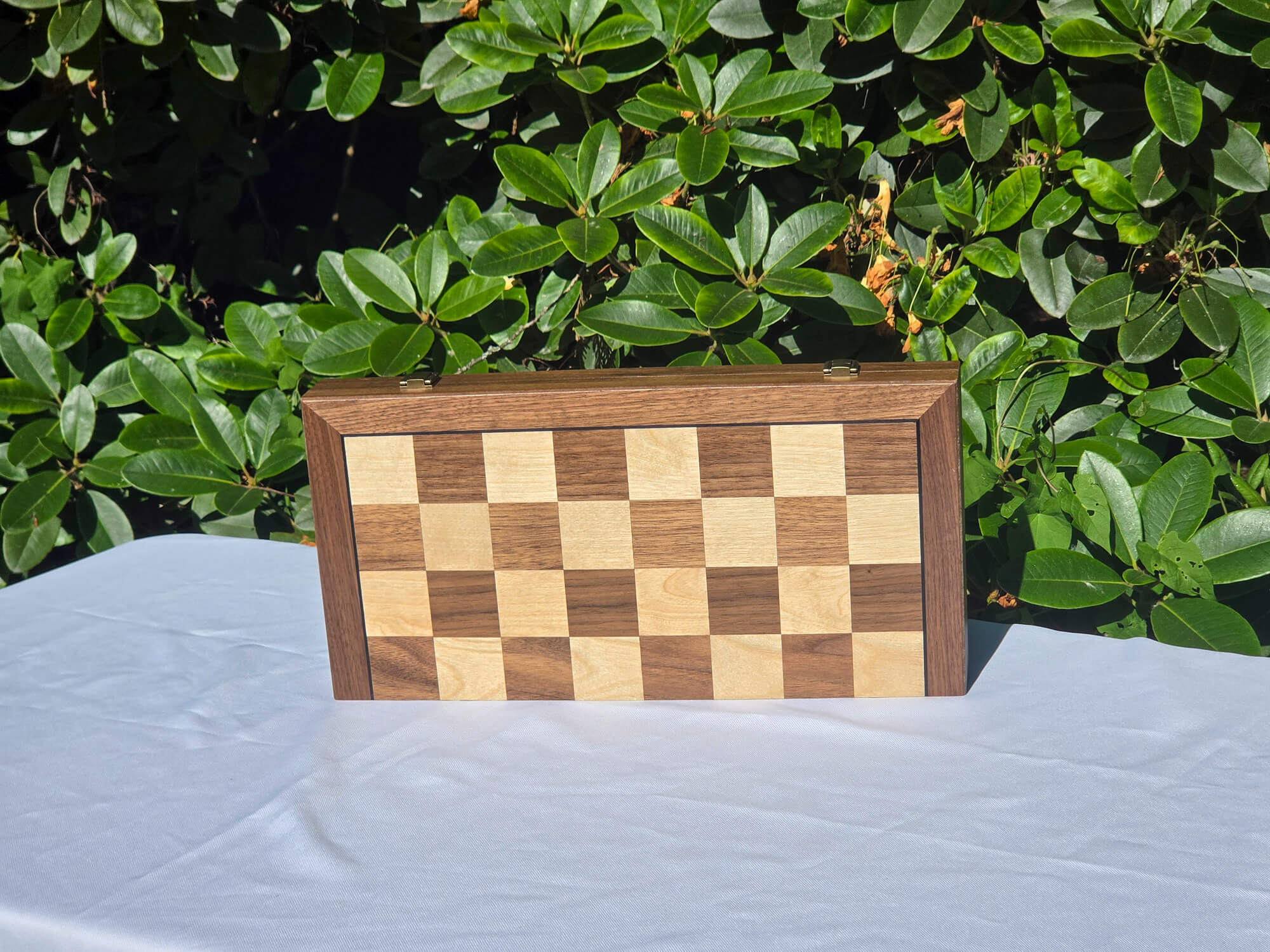 Marquis Magnetic Walnut Chess Set folding case standing closed, showing the walnut and maple checkerboard exterior.