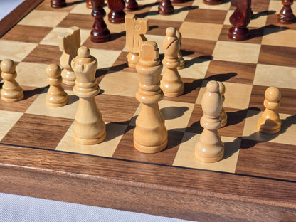 Close-up of light colour magnetic Staunton chess pieces on the Marquis Magnetic Walnut Chess Set board