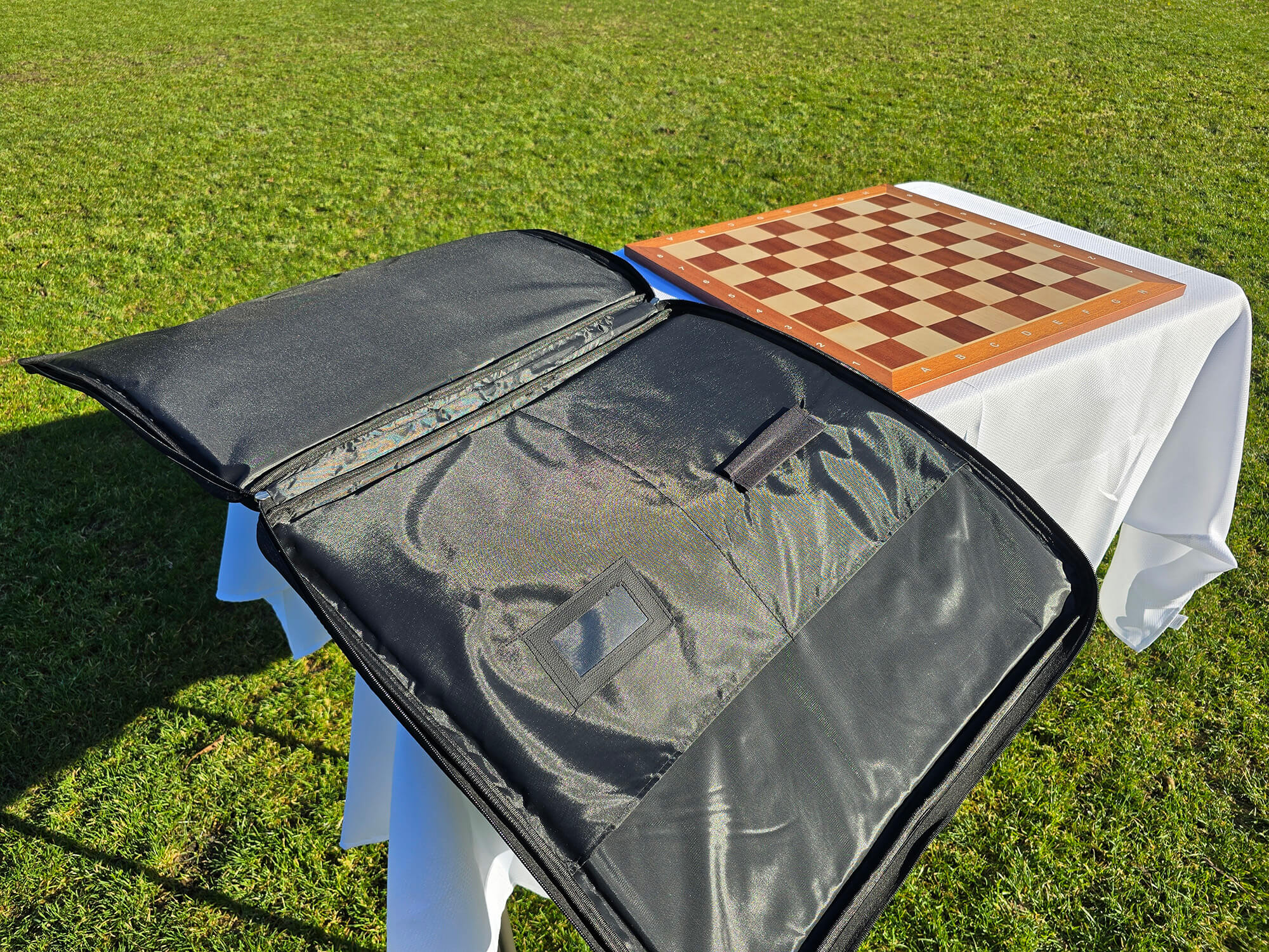 Close-up of the Monarch padded chess bag showing the pen holder and integrated business card holder.