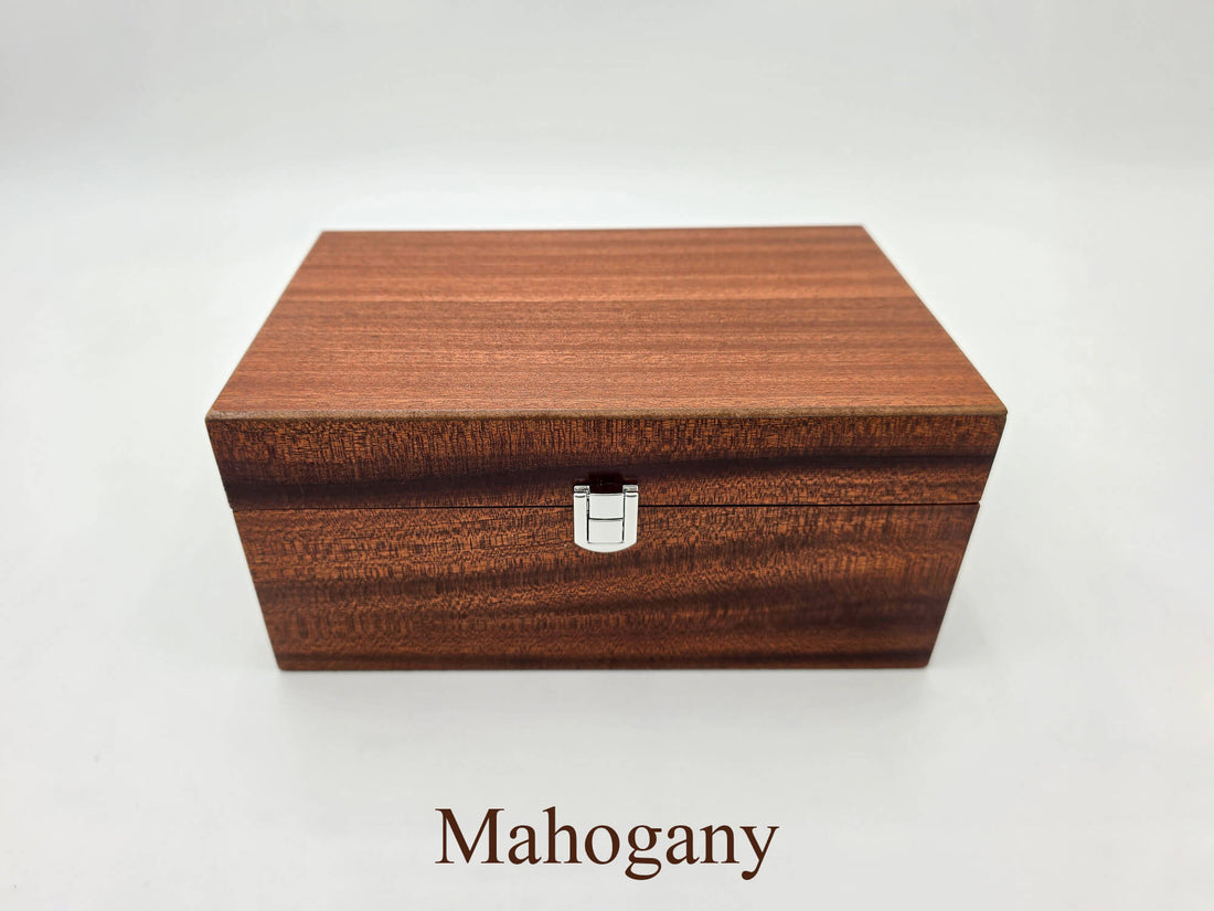 Front view of the closed Monarch mahogany wooden chess set box showing wood grain and silver latch.