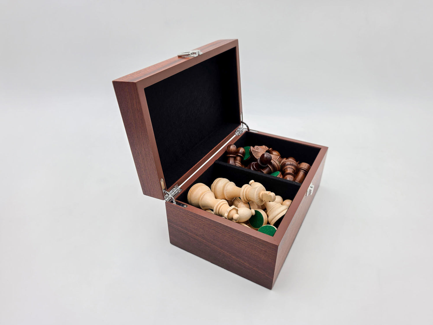 Left angled view of the Monarch mahogany chess box open with pieces inside.