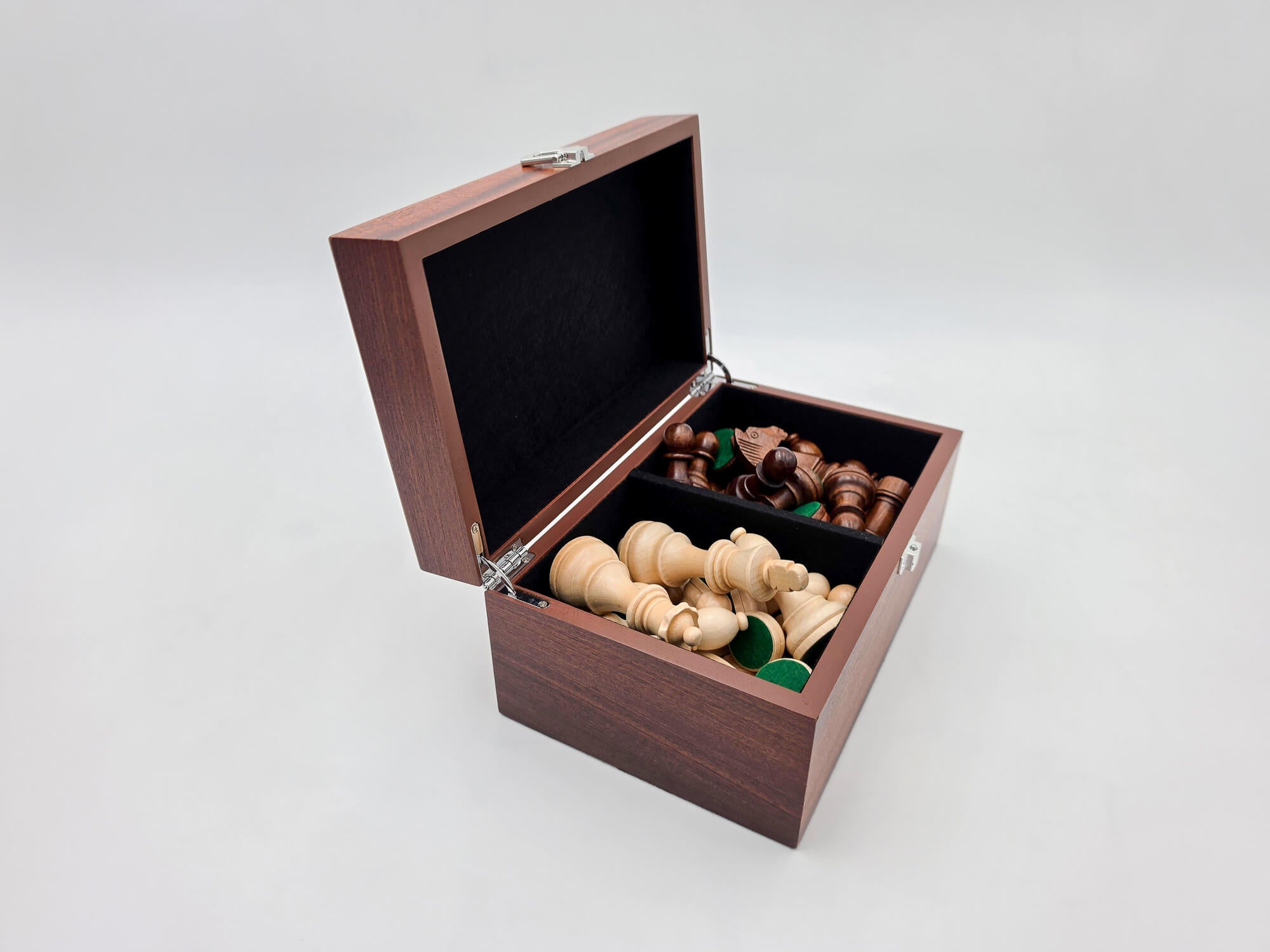 Left angled view of the Monarch mahogany chess box open with pieces inside.