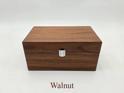 Front view of the closed Monarch walnut wooden chess storage box featuring dark wood grain.