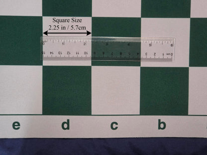 High-definition close-up product photograph of a green and white mousepad chess board section with a transparent ruler and callout labels verifying the 2.25-inch square dimension.