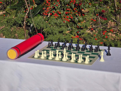 Red Sentry telescopic chess tube with roll-up board and Staunton chess set.