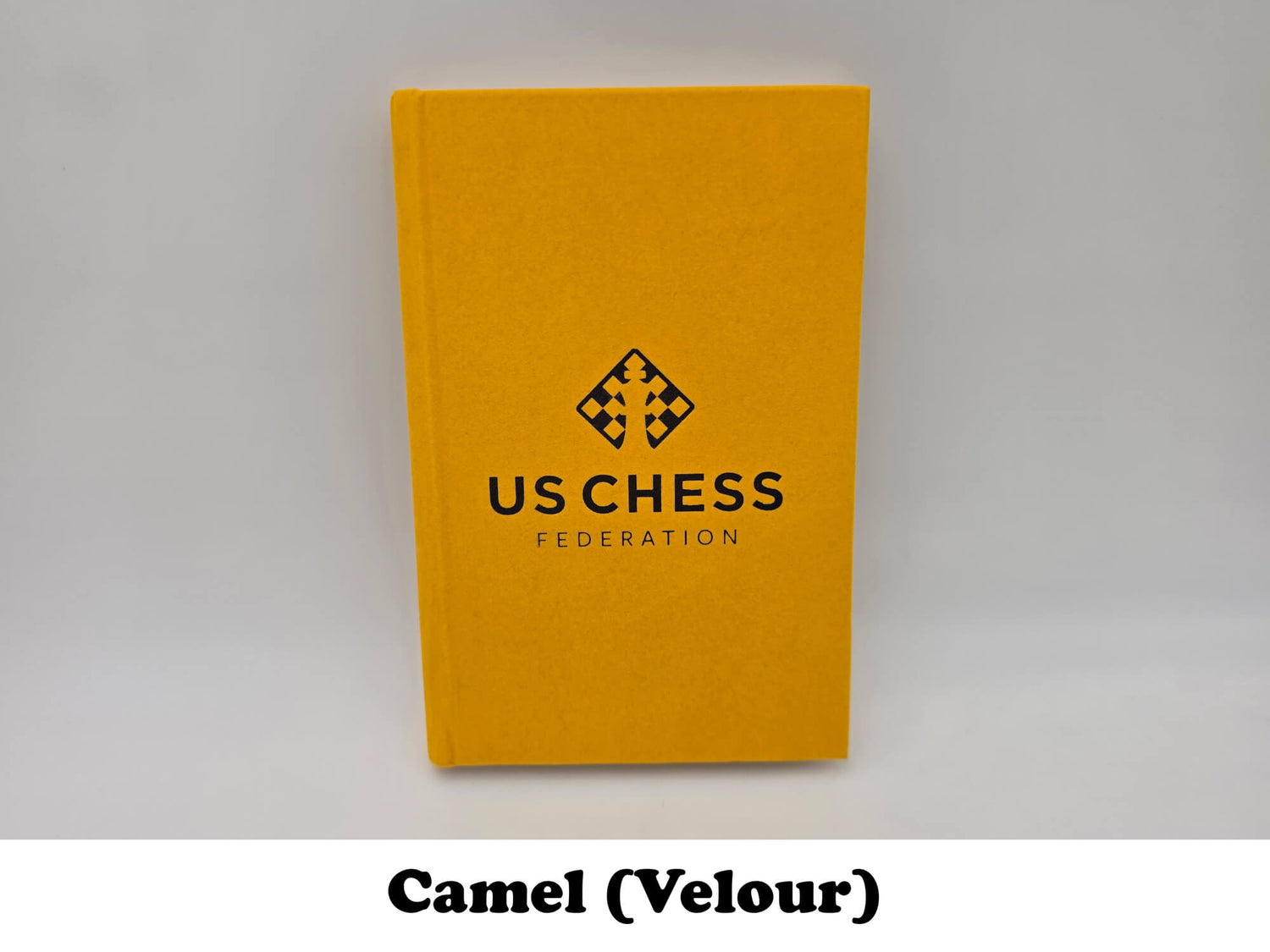 Camel orange velour USCF chess notation scorebook cover.