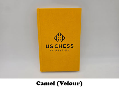 Camel orange velour USCF chess notation scorebook cover.